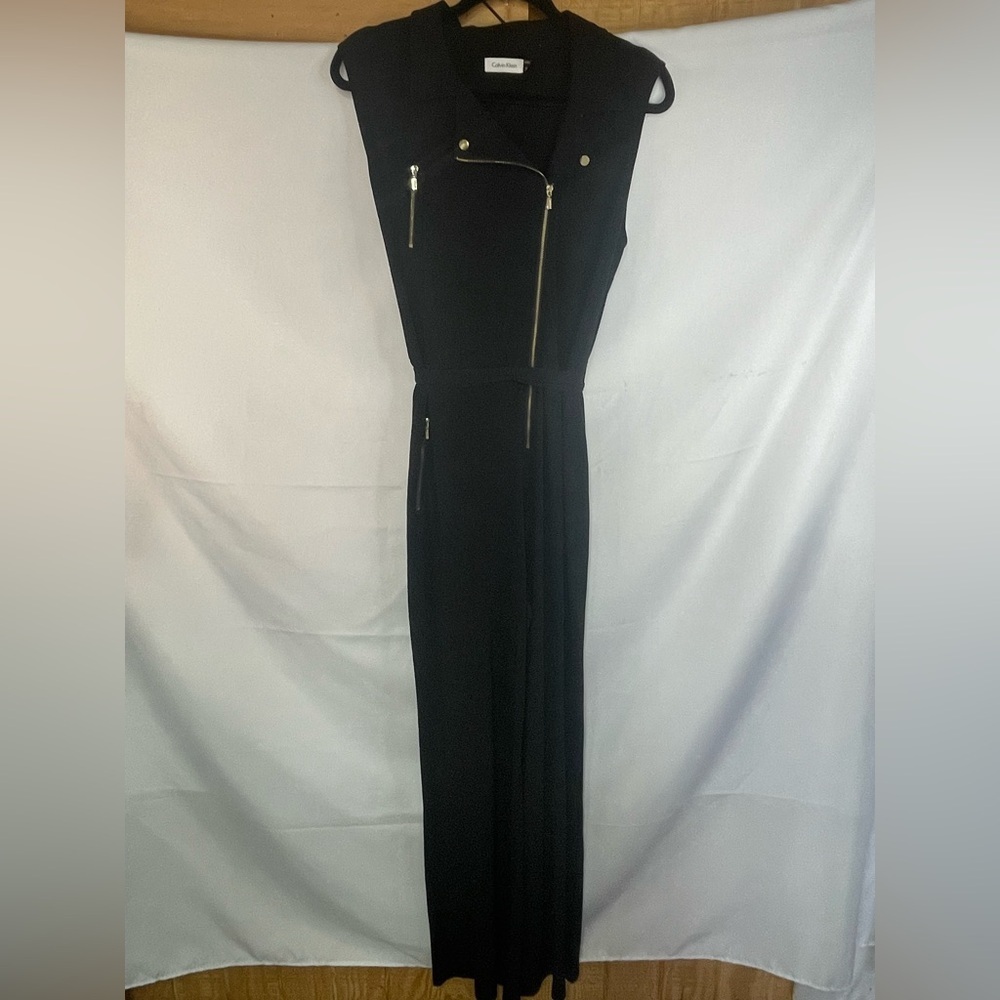 Calvin Klein slinky jumpsuit with gold accents and a flat lapel.